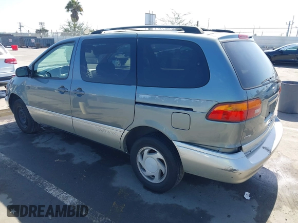 1999 Toyota Sienna LE with VIN 4T3ZF13C5XU099020, listed as a IAAI auction lot 41709287 with 206,884 mi miles. Bid and sale history available at carsss.com. Image 3.