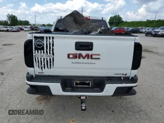 2021 GMC Canyon 4WD AT4 z VIN 1GTG6FEN9M1147406, wystawiony jako Copart lot #55454634 z przebiegiem 82 898 mil mil oraz Szkody całkowita. Historia ofert i sprzedaży dostępna na DreamBid. Obrazek 6.