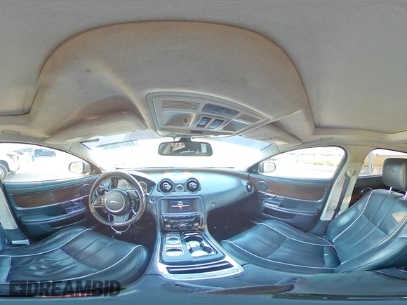 2014 Jaguar XJ Portfolio with VIN SAJWJ2GD7E8V61558, listed as a Copart auction lot 66850034 with 130,984 mi miles and Salvage title. Bid and sale history available at DreamBid. Image 12.