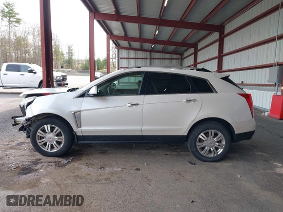 2015 Cadillac SRX Luxury Collection with VIN 3GYFNEE30FS567431, listed as a IAAI auction lot 42118084 with 140,778 mi miles. Bid and sale history available at carsss.com. Image 14.