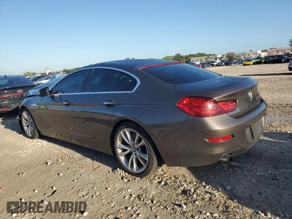 2014 BMW 6 Series 640i z VIN WBA6A0C58EDZ04545, wystawiony jako Copart lot #71086984 z przebiegiem 99 048 mil mil oraz Szkoda całkowita • Salvage title. Historia ofert i sprzedaży dostępna na DreamBid. Obrazek 2.