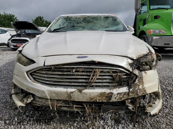2017 Ford Fusion Titanium z VIN 3FA6P0K93HR227511, wystawiony jako Copart lot #60719505 z przebiegiem Nie podano mil oraz Szkoda całkowita • Salvage title. Historia ofert i sprzedaży dostępna na DreamBid. Obrazek 5.