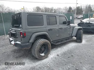 2019 Jeep Wrangler Unlimited Sahara with VIN 1C4HJXEG8KW533339, listed as a IAAI auction lot 40963653 with 69,202 mi miles and . Bid and sale history available at DreamBid. Image 4.