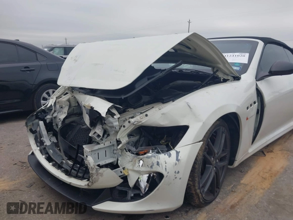 2013 Maserati GranTurismo Convertible Sport with VIN ZAM45VMA9D0070293, listed as a IAAI auction lot 41241020 with 69,156 mi miles. Bid and sale history available at carsss.com. Image 6.