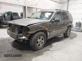 1999 Jeep Grand Cherokee Laredo with VIN 1J4GW58SXXC584734, listed as a IAAI auction lot 41902224 with 209,180 mi miles and . Bid and sale history available at DreamBid. Image 2.