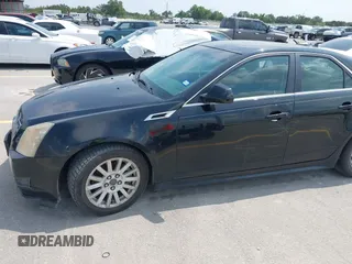 2013 Cadillac CTS Luxury with VIN 1G6DE5E50D0101763, listed as a IAAI auction lot 42090577 with 105,097 mi miles and . Bid and sale history available at DreamBid. Image 6.