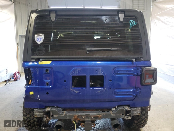 2020 Jeep Wrangler Unlimited Black and Tan with VIN 1C4HJXDG1LW267312, listed as a Copart auction lot 49658135 with 66,624 mi miles and Salvage title. Bid and sale history available at DreamBid. Image 6.