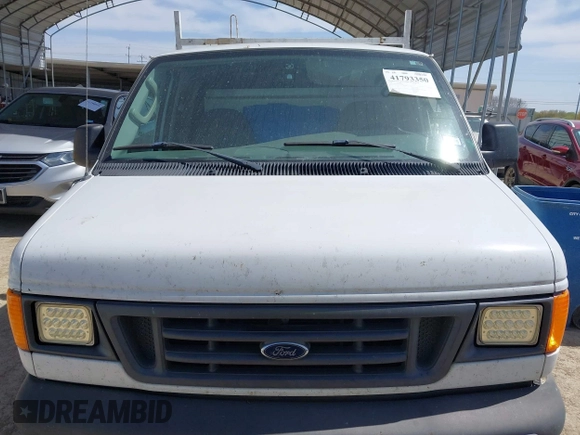 2004 Ford Econoline Cargo with VIN 1FTRE14W44HA29084, listed as a IAAI auction lot 41793350 with 123,429 mi miles. Bid and sale history available at carsss.com. Image 12.