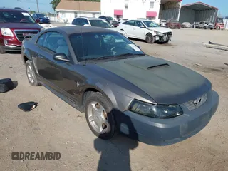 2001 Ford Mustang Standard with VIN 1FAFP40461F264327, listed as a IAAI auction lot 42002990 with 316,107 mi miles. Bid and sale history available at carsss.com. Image 1.