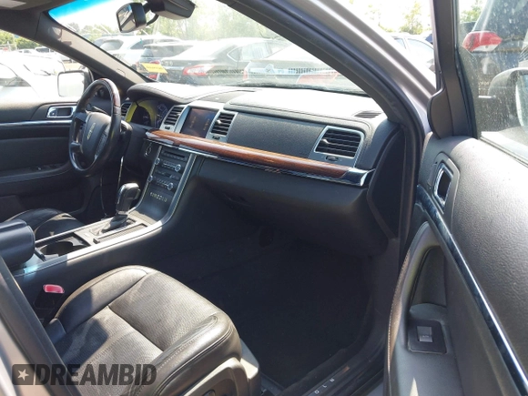 2012 Lincoln MKS EcoBoost with VIN 1LNHL9FT4CG802557, listed as a IAAI auction lot 42642544 with 250,983 mi miles and . Bid and sale history available at DreamBid. Image 5.