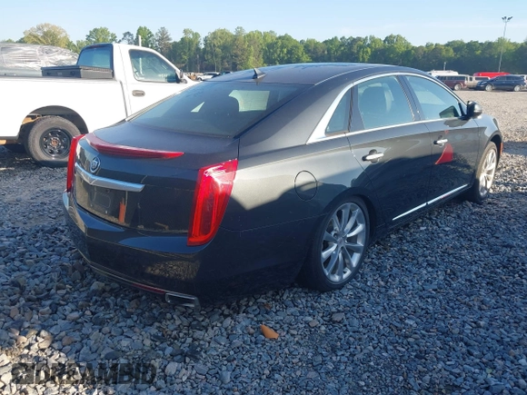 2013 Cadillac XTS Luxury with VIN 2G61P5S3XD9141306, listed as a IAAI auction lot 42034077 with 120,294 mi miles. Bid and sale history available at carsss.com. Image 4.