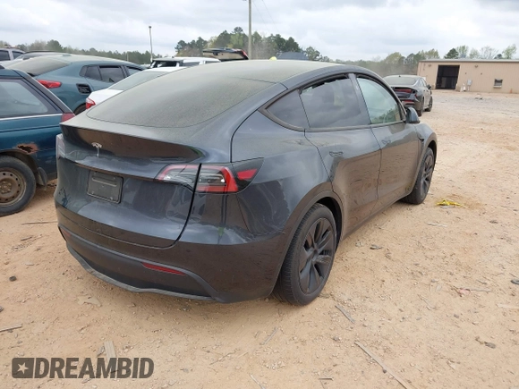 2024 Tesla Model Y with VIN 7SAYGDED3RA303113, listed as a IAAI auction lot 41915760 with 12,917 mi miles and . Bid and sale history available at DreamBid. Image 4.