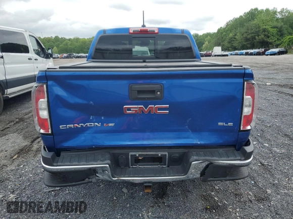 2019 GMC Canyon 4WD SLE z VIN 1GTG6CEN1K1206640, wystawiony jako Copart lot #55339285 z przebiegiem 52 166 mil mil oraz Szkody całkowita. Historia ofert i sprzedaży dostępna na DreamBid. Obrazek 6.