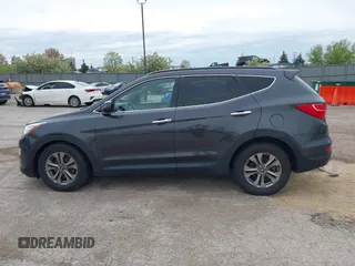 2016 Hyundai Santa Fe z VIN 5XYZU3LB0GG318165, wystawiony jako IAAI lot #42158474 z przebiegiem 74 420 mil mil oraz . Historia ofert i sprzedaży dostępna na DreamBid. Obrazek 13.