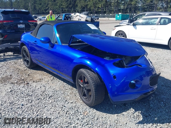 2006 Mazda MX-5 Miata Touring z VIN JM1NC25F560104482, wystawiony jako IAAI lot #42045035 z przebiegiem 131 892 mil mil oraz . Historia ofert i sprzedaży dostępna na DreamBid. Obrazek 1.