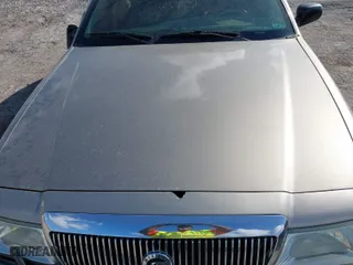 2004 Mercury Grand Marquis LS Premium with VIN 2MEFM75W14X606756, listed as a IAAI auction lot 41572470 with 106,498 mi miles. Bid and sale history available at carsss.com. Image 10.