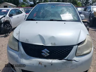 2008 Suzuki SX4 Touring 2 z VIN JS2YC417285100960, wystawiony jako IAAI lot #42166346 z przebiegiem 162 498 mil mil oraz . Historia ofert i sprzedaży dostępna na DreamBid. Obrazek 12.