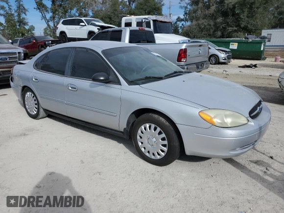 2003 Ford Taurus LX Standard z VIN 1FAFP52U43A110444, wystawiony jako Copart lot #83557764 z przebiegiem 118 897 mil mil oraz Szkoda całkowita • Salvage title. Historia ofert i sprzedaży dostępna na DreamBid. Obrazek 4.
