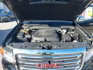 2015 GMC Canyon 4WD SLT z VIN 1GTG6CE33F1134747, wystawiony jako IAAI lot #41502300 z przebiegiem 143 027 mil mil oraz . Historia ofert i sprzedaży dostępna na DreamBid. Obrazek 10.
