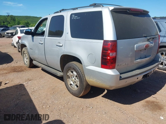 2014 Chevrolet Tahoe LT with VIN 1GNSCBE00ER147899, listed as a IAAI auction lot 42322761 with 299,342 mi miles and . Bid and sale history available at DreamBid. Image 3.
