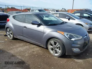 2016 Hyundai Veloster with VIN KMHTC6AD0GU293633, listed as a IAAI auction lot 41667490 with 65,757 mi miles. Bid and sale history available at carsss.com. Image 1.