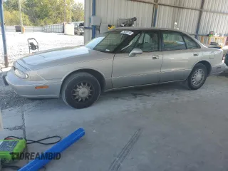 1998 Oldsmobile 88 LS z VIN 1G3HN52K4W4803377, wystawiony jako Copart lot #75638114 z przebiegiem 75 754 mil mil oraz Tytuł czysty. Historia ofert i sprzedaży dostępna na DreamBid. Obrazek 1.