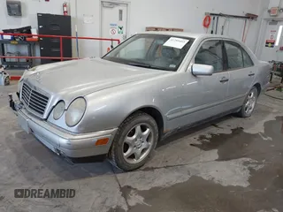 1999 Mercedes-Benz E-Class with VIN WDBJF82HXXX022432, listed as a IAAI auction lot 41793493 with 1 mi miles. Bid and sale history available at carsss.com. Image 2.