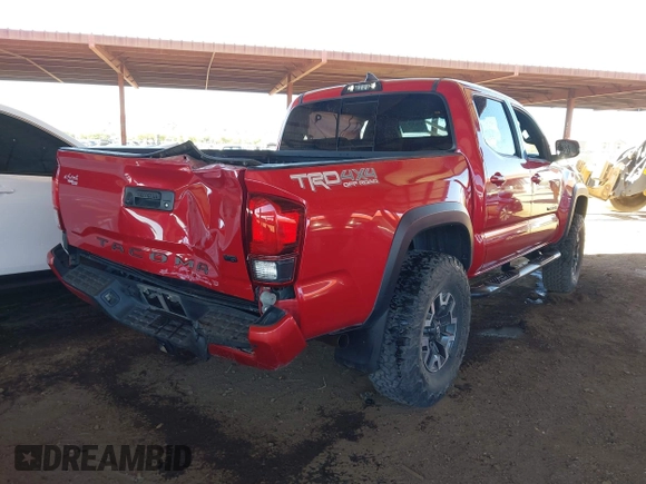 2018 Toyota Tacoma SR with VIN 3TMCZ5AN8JM141486, listed as a IAAI auction lot 42142145 with 54,851 mi miles and . Bid and sale history available at DreamBid. Image 4.