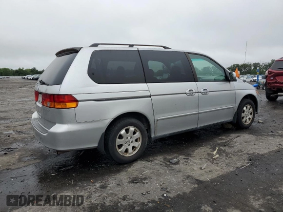 2003 Honda Odyssey EX z VIN 5FNRL18603B008148, wystawiony jako Copart lot #60669825 z przebiegiem 128 115 mil mil oraz Czysty tytuł • Clean title. Historia ofert i sprzedaży dostępna na DreamBid. Obrazek 3.