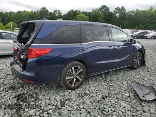 2018 Honda Odyssey Elite z VIN 5FNRL6H9XJB039802, wystawiony jako Copart lot #57116345 z przebiegiem 107 939 mil mil oraz Szkody całkowita. Historia ofert i sprzedaży dostępna na DreamBid. Obrazek 3.