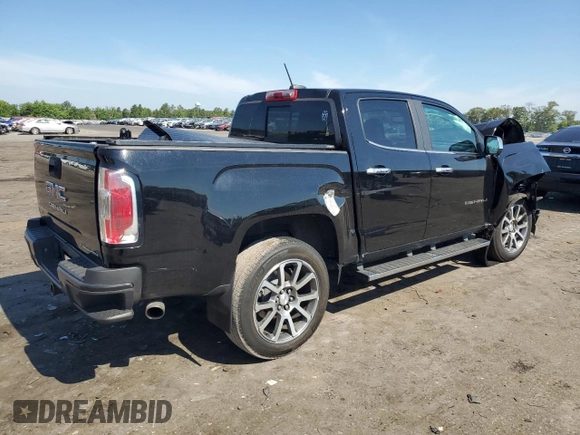 2021 GMC Canyon 4WD Denali with VIN 1GTG6EEN9M1255163, listed as a Copart auction lot 59868834 with 63,853 mi miles and Salvage Title. Bid and sale history available at carsss.com. Image 3.