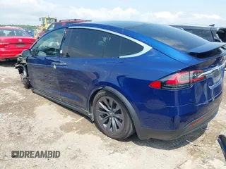 2018 Tesla Model X 75D with VIN 5YJXCAE21JF132628, listed as a IAAI auction lot 42081282 with 35,360 mi miles and . Bid and sale history available at carsss.com. Image 3.