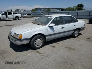 1989 Ford Taurus GL z VIN 1FABP52UXKG244224, wystawiony jako Copart lot #59239225 z przebiegiem 30 853 mil mil oraz Czysty tytuł • Clean title. Historia ofert i sprzedaży dostępna na DreamBid. Obrazek 1.