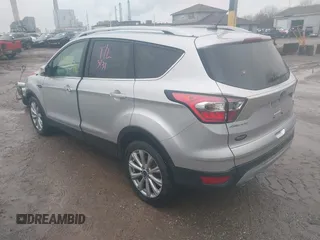 2017 Ford Escape Titanium with VIN 1FMCU0J96HUC21987, listed as a IAAI auction lot 41971376 with 97,488 mi miles and . Bid and sale history available at DreamBid. Image 3.