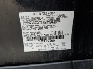 2014 Ford Taurus SEL z VIN 1FAHP2E85EG184686, wystawiony jako Copart lot #55862775 z przebiegiem 238 217 mil mil oraz Czysty tytuł • Clean title. Historia ofert i sprzedaży dostępna na DreamBid. Obrazek 12.