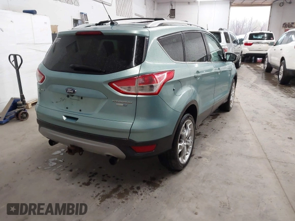 2013 Ford Escape Titanium with VIN 1FMCU9J9XDUC60029, listed as a IAAI auction lot 41936948 with 184,012 mi miles and . Bid and sale history available at DreamBid. Image 4.
