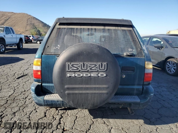 1999 Isuzu Rodeo S with VIN 4S2CK58W1X4349947, listed as a Copart auction lot 84634064 with 135,851 mi miles and Clean Title. Bid and sale history available at DreamBid. Image 6.