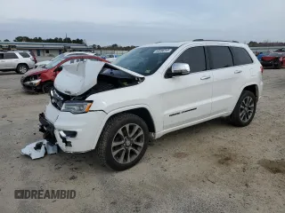 2018 Jeep Grand Cherokee Overland with VIN 1C4RJFCG1JC509143, listed as a Copart auction lot 50096345 with 104,944 mi miles and Salvage title. Bid and sale history available at DreamBid. Image 1.