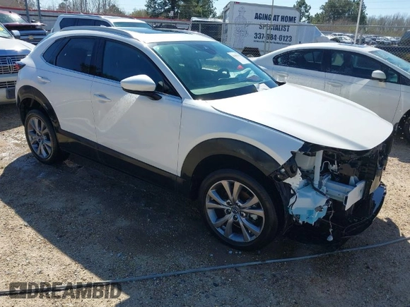 2022 Mazda CX-30 S Premium with VIN 3MVDMBDL1NM413540, listed as a IAAI auction lot 41681191 with 57,764 mi miles and . Bid and sale history available at carsss.com. Image 1.