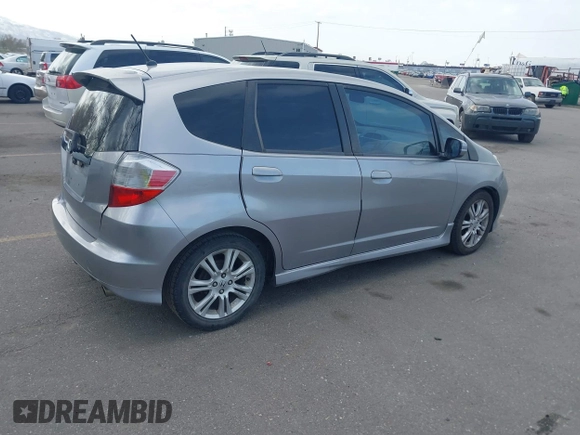 2009 Honda Fit Sport with VIN JHMGE884X9S045470, listed as a IAAI auction lot 41993638 with 181,198 mi miles. Bid and sale history available at carsss.com. Image 4.