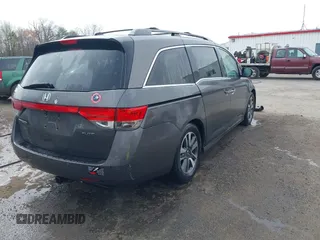 2014 Honda Odyssey Touring with VIN 5FNRL5H94EB020257, listed as a IAAI auction lot 41924245 with 204,526 mi miles and . Bid and sale history available at DreamBid. Image 4.