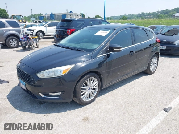 2015 Ford Focus Titanium z VIN 1FADP3N27FL219978, wystawiony jako IAAI lot #42433005 z przebiegiem 175 459 mil mil oraz . Historia ofert i sprzedaży dostępna na DreamBid. Obrazek 2.