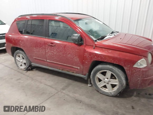 2010 Jeep Compass Sport with VIN 1J4NF4FB2AD506051, listed as a IAAI auction lot 41552084 with 218,785 mi miles. Bid and sale history available at carsss.com. Image 1.