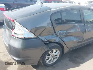 2010 Honda Insight EX with VIN JHMZE2H71AS032532, listed as a IAAI auction lot 41988221 with 333,144 mi miles and . Bid and sale history available at DreamBid. Image 6.