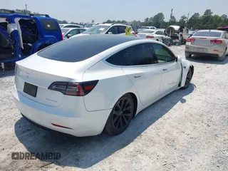 2019 Tesla Model 3 Long Range with VIN 5YJ3E1EB4KF494432, listed as a IAAI auction lot 42009327 with 121,954 mi miles and . Bid and sale history available at DreamBid. Image 4.
