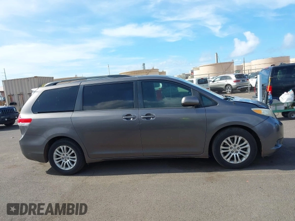 2014 Toyota Sienna XLE with VIN 5TDYK3DC2ES438980, listed as a IAAI auction lot 42067750 with 143,728 mi miles and . Bid and sale history available at DreamBid. Image 13.