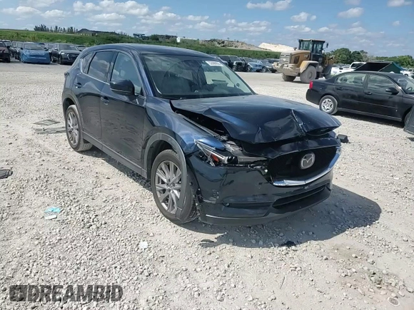 2021 Mazda CX-5 Grand Touring with VIN JM3KFADM1M0301366, listed as a Copart auction lot 52890955 with 66,686 mi miles and Non Repairable. Bid and sale history available at carsss.com. Image 12.