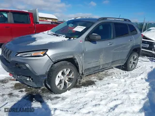 2015 Jeep Cherokee Trailhawk with VIN 1C4PJMBS2FW503293, listed as a IAAI auction lot 41368800 with 144,794 mi miles. Bid and sale history available at carsss.com. Image 17.