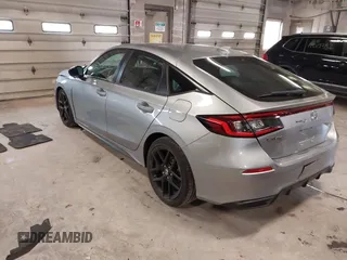 2023 Honda Civic Sport with VIN 19XFL2H80PE010679, listed as a IAAI auction lot 42026973 with 25,701 mi miles and . Bid and sale history available at DreamBid. Image 3.