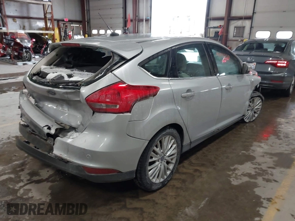 2018 Ford Focus Titanium with VIN 1FADP3N25JL261736, listed as a IAAI auction lot 41032128 with 59,142 mi miles and . Bid and sale history available at DreamBid. Image 4.